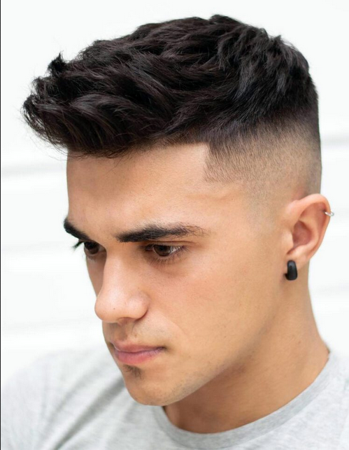 Longer hair on top with textured Haircut style for men