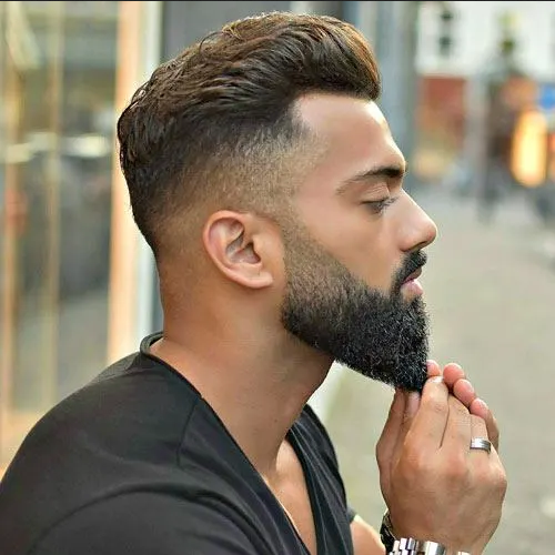 Skin fade in medium length with beard Haircut style for men